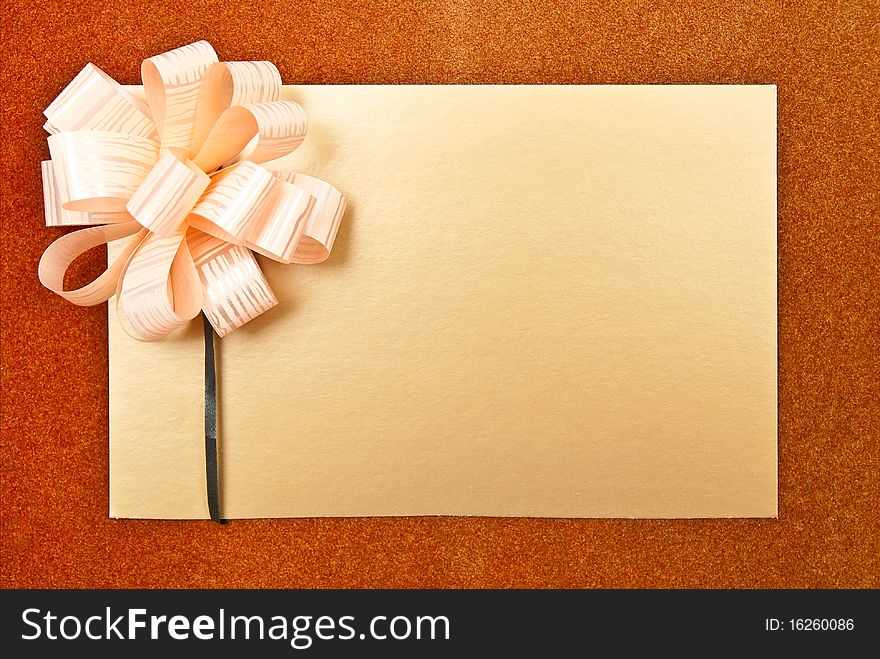 Paper blank with bow on grey background