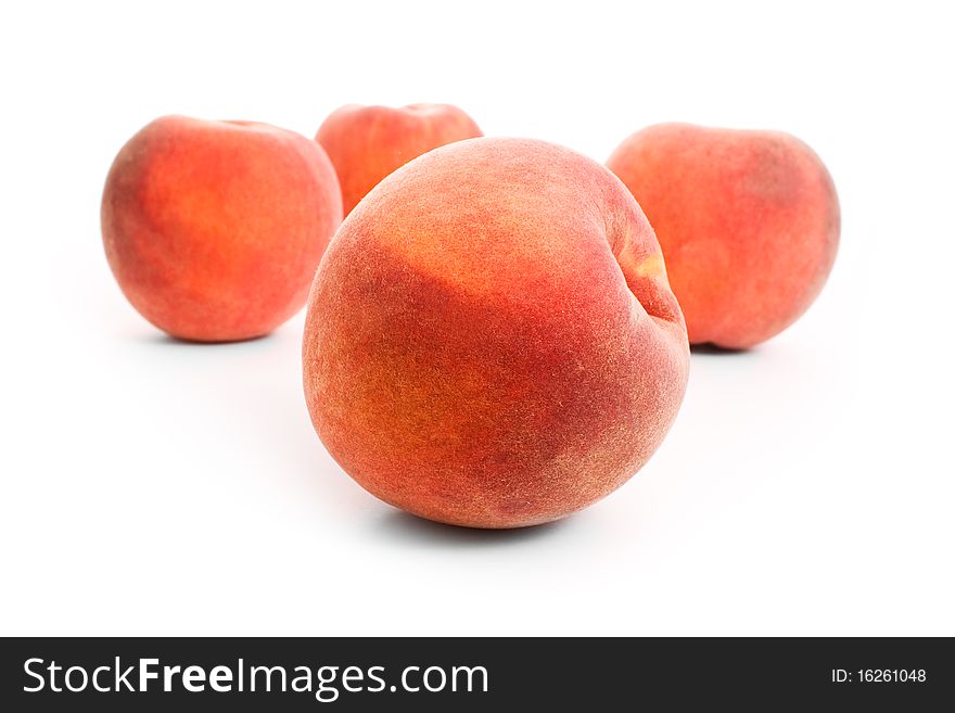 Close up shot of peaches isolated on white