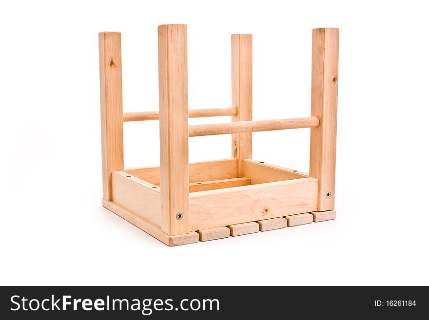Ovarturned wooden stool isolated on white. Ovarturned wooden stool isolated on white