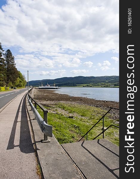 View along the promenade of Colintraive, Argyllshire, Scotland looking towards the car ferry in the distance. View along the promenade of Colintraive, Argyllshire, Scotland looking towards the car ferry in the distance