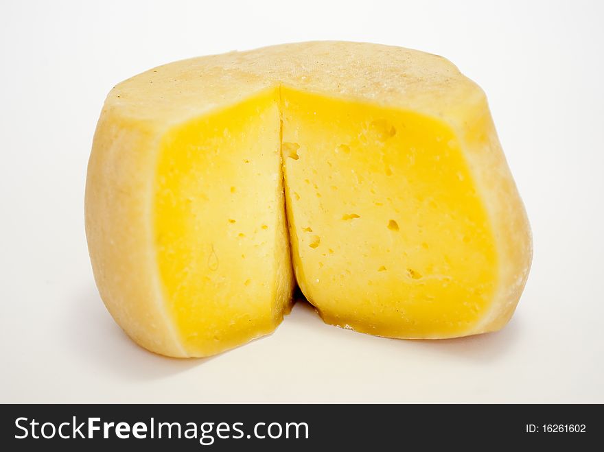 Oaf of cheddar cheese isolated on white background