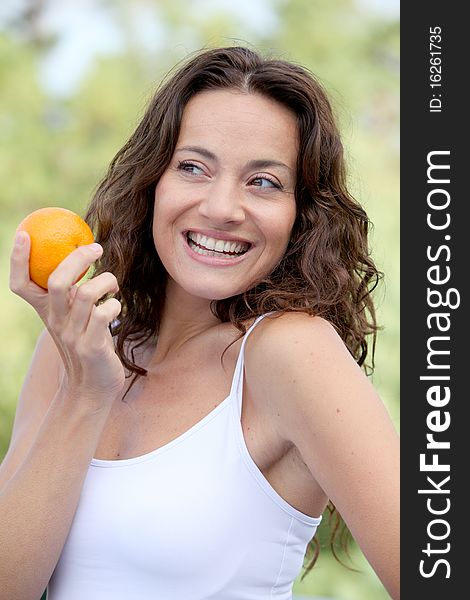 Closeup of woman eating an orange. Closeup of woman eating an orange