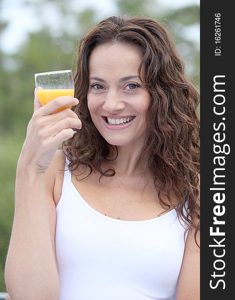 Closeup of beautiful woman drinking orange juice. Closeup of beautiful woman drinking orange juice