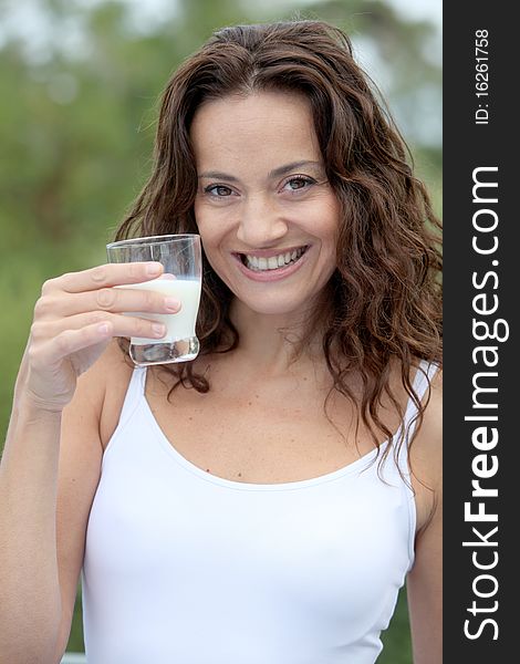 Closeup of beautiful woman drinking milk. Closeup of beautiful woman drinking milk