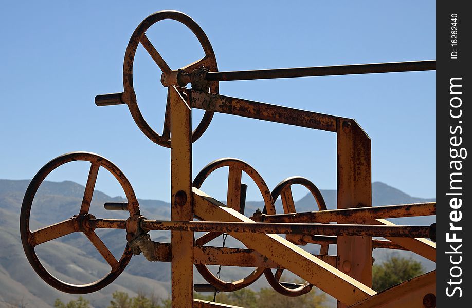 Steering wheels on an antique Adams Leaning Wheel Grader tractor in Laws, California. Steering wheels on an antique Adams Leaning Wheel Grader tractor in Laws, California