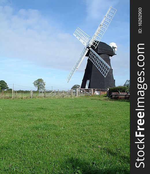 English windmill in a summer landscape. English windmill in a summer landscape