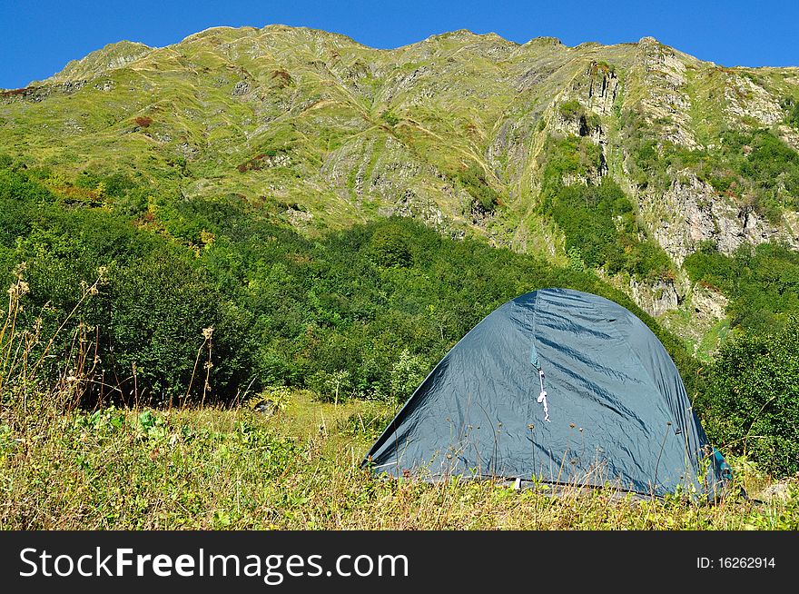 Tent against the backdrop of the magnificent mountain range