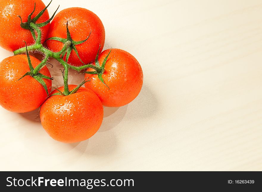 Fresh Tomatoes With Water Drops On White