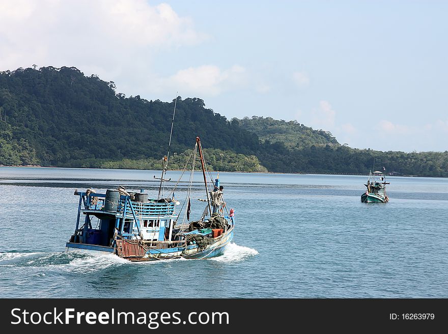 The fisherman boat are fishing.