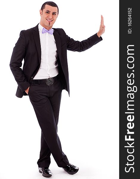 Full body portrait of a business man standing against the wall in a isolated white background. Full body portrait of a business man standing against the wall in a isolated white background