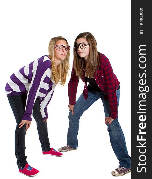 Young trendy teenagers in a nerd / geek style. Isolated over white background.
