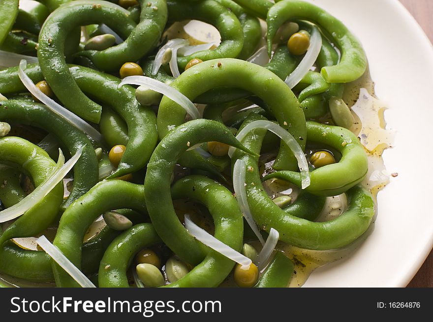 Fresh green bean salad with onion and vinegar close up