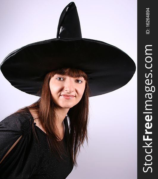 Young witch in a pointed hat