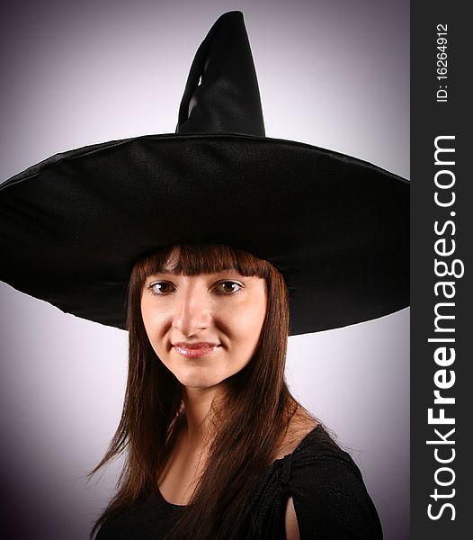 Young witch in a pointy hat