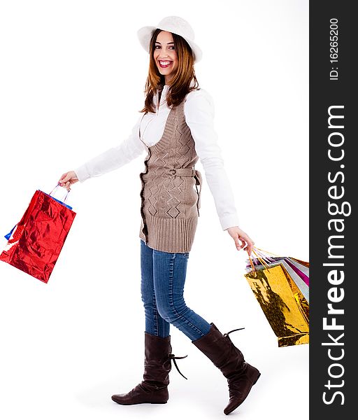 Young woman enjoyed shopping and carrying her bags on a white background