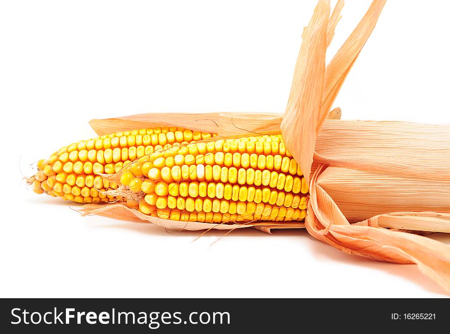 Fresh corn vegetable with leaves isolated on white background