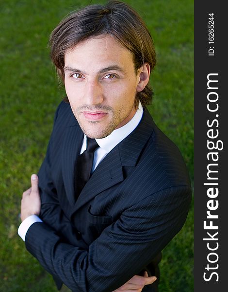 Young businessman in garden