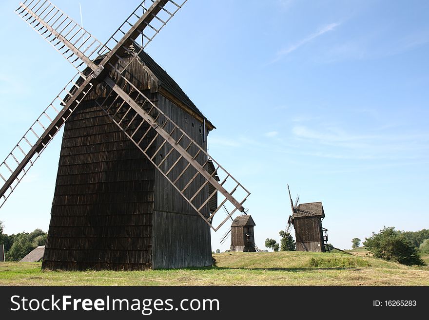 Antique trestle type Windmills from the 19th century on a hill