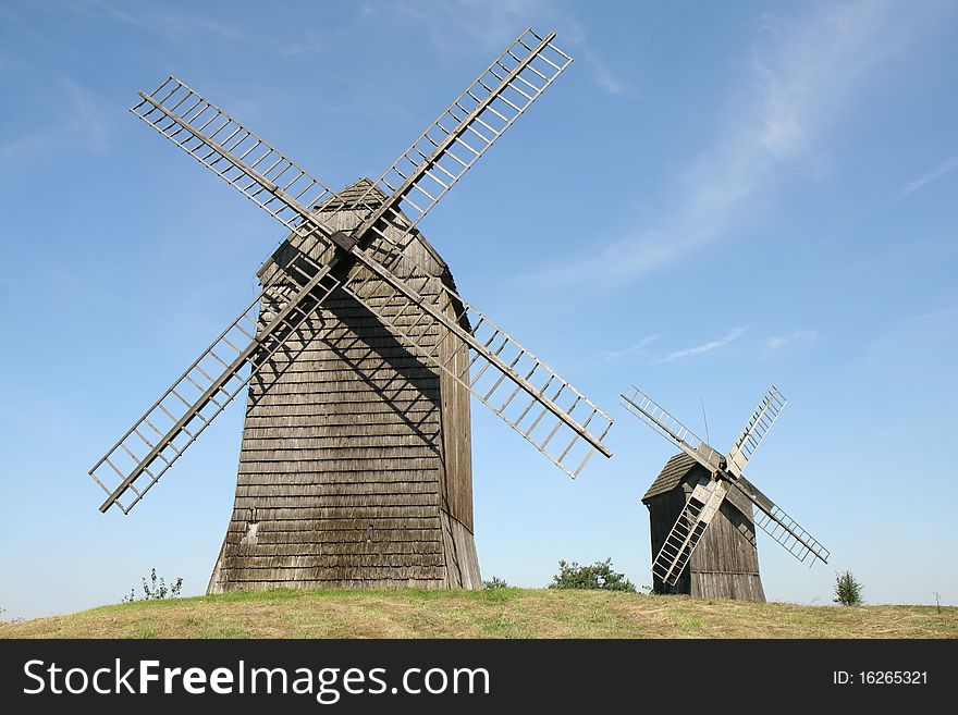 Antique trestle type Windmills from the 19th century on a hill