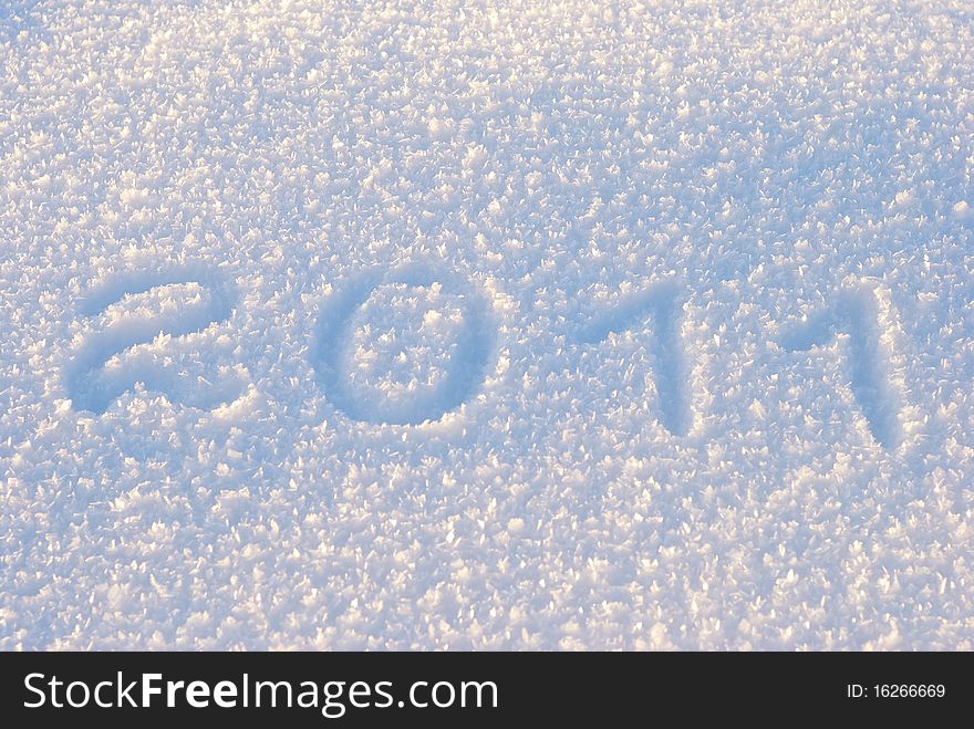 Text 2011 written on snow pattern. Text 2011 written on snow pattern