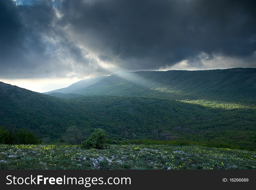 Mountain landscape with view of dramatic sunset