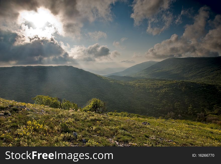 Mountain landscape with view of dramatic sunset