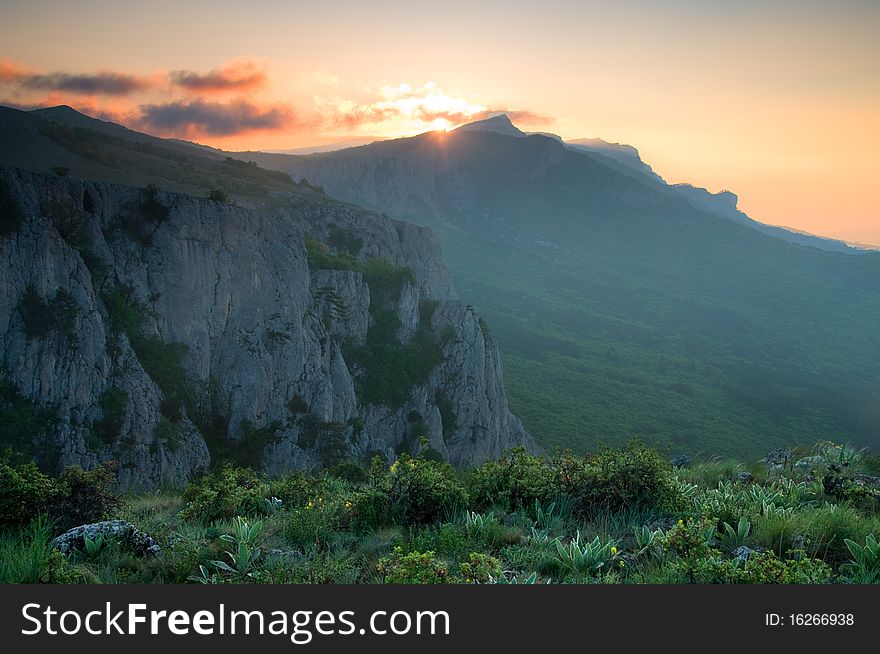 Mountain landscape with view of dramatic sunrise