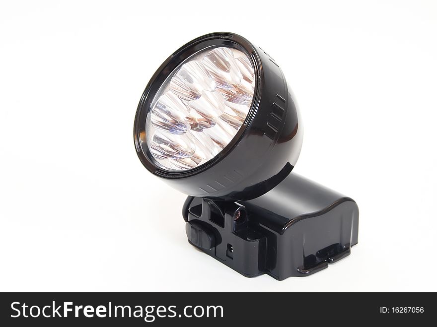 Black flashlight isolated on seamless white background