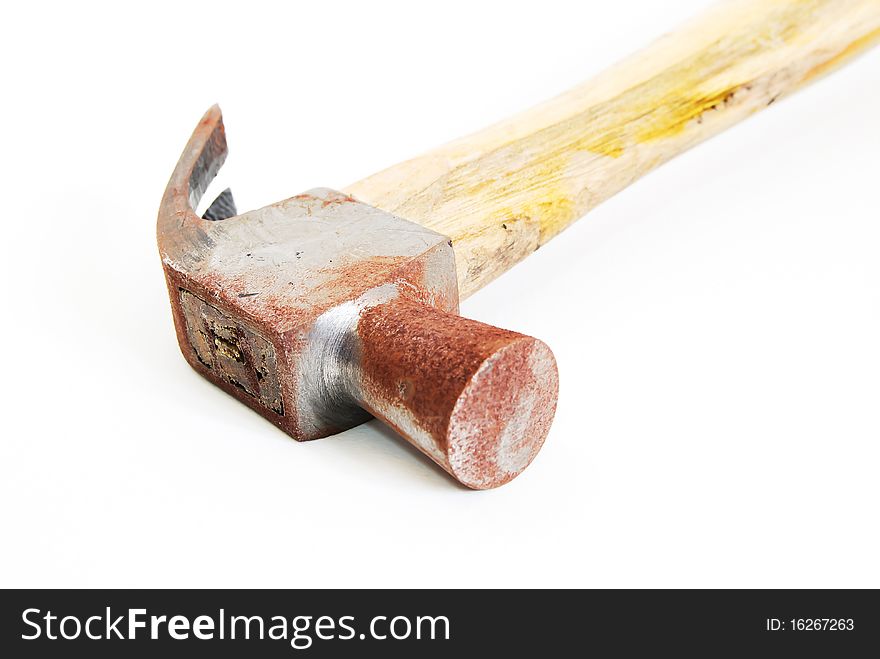 Old rusty hammer isolated on seamless white background