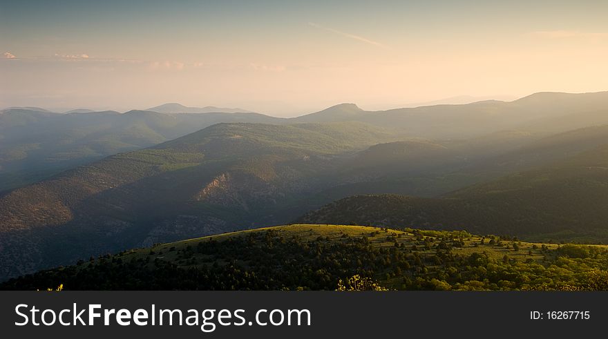 Mountain landscape with view of dramatic sunset