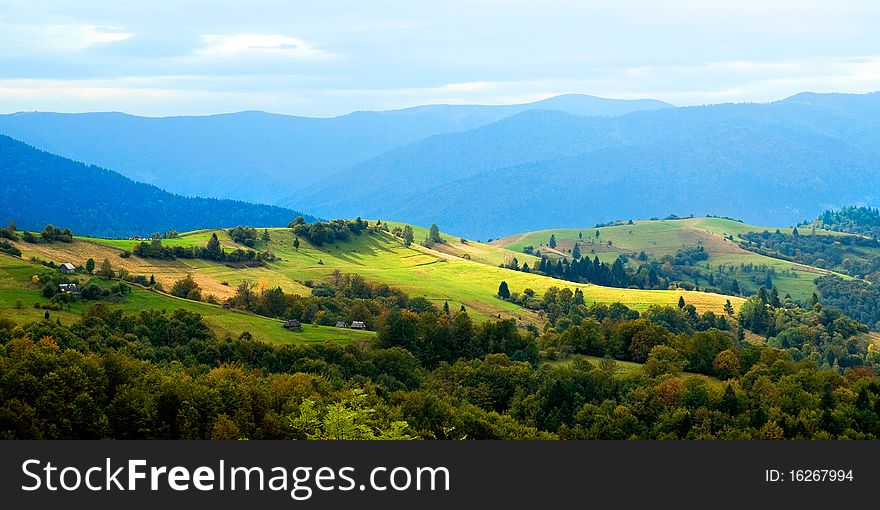 Ukrainian tranquil autumnal landscape with meadow and mountains. Ukrainian tranquil autumnal landscape with meadow and mountains.