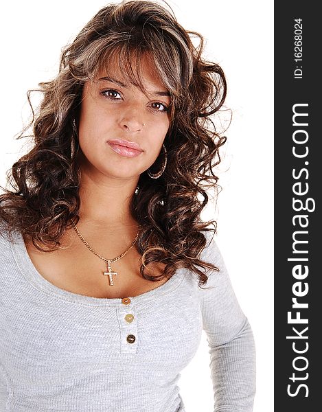 An beautiful brunet young woman with curly long hair and a gray
sweater standing for a portrait in the studio, for white background. An beautiful brunet young woman with curly long hair and a gray
sweater standing for a portrait in the studio, for white background.