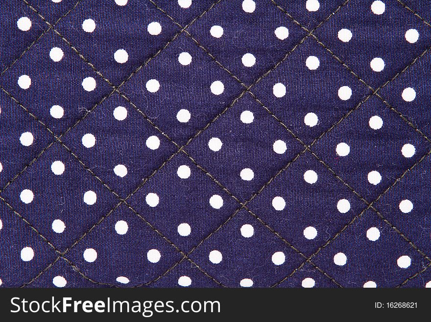 White spots on blue cloth background