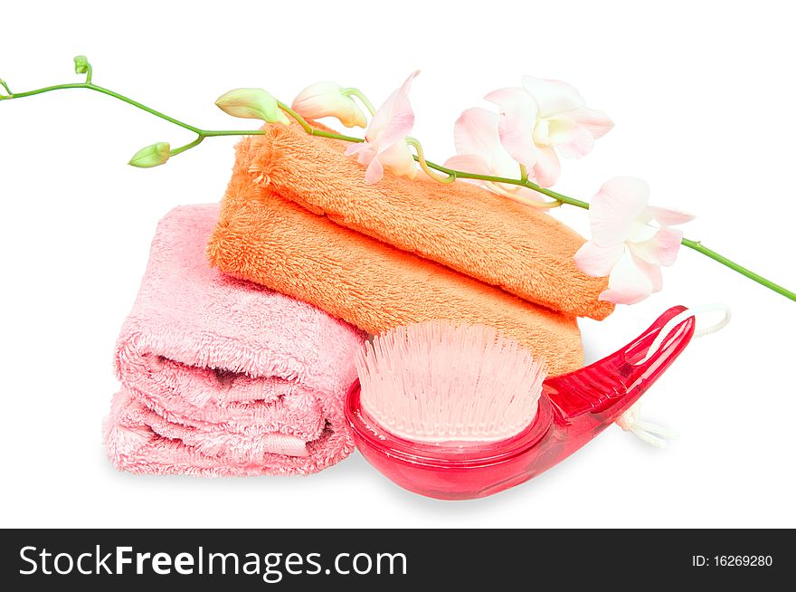 Two rolled towels and flower on white background. Two rolled towels and flower on white background