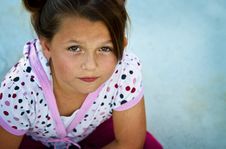 Beautiful Young Girl On A Concrete Patio. Royalty Free Stock Image