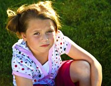 Beautiful Young Girl Unhappy On The Grass Royalty Free Stock Photography Beautiful Young Girl Unhappy On The Grass Royalty Free Stock Photography