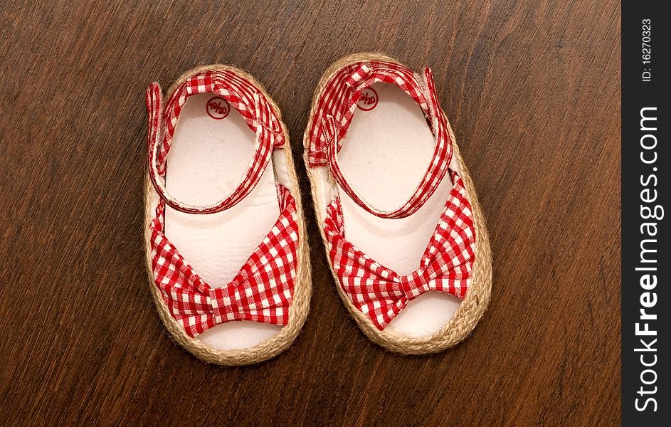 Child's shoe on a dark background