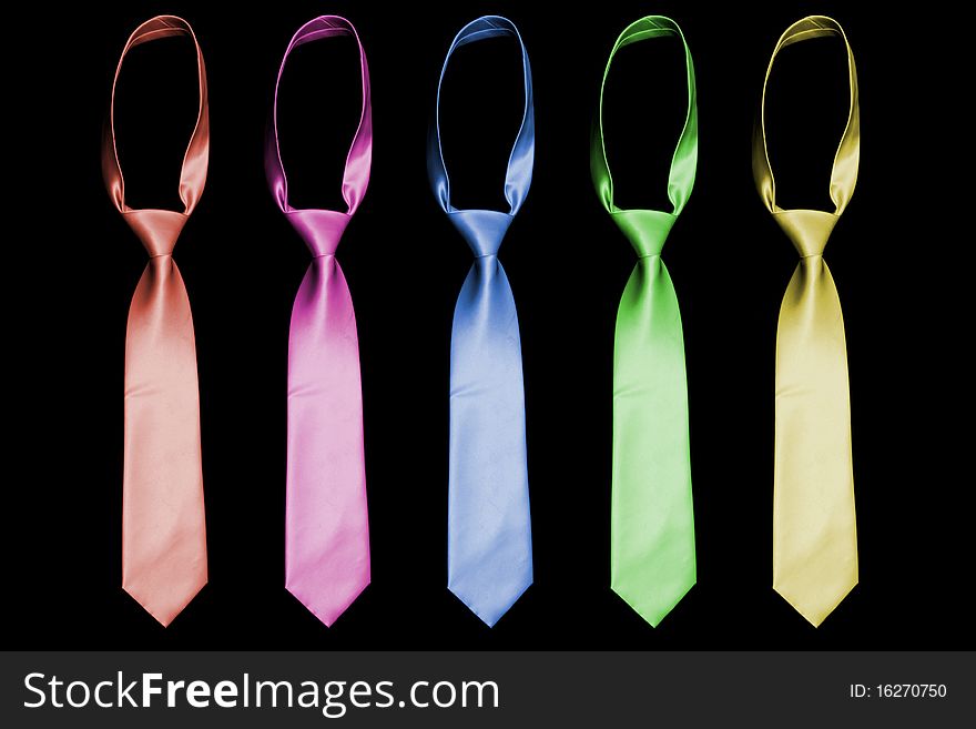 A set of neckties on black