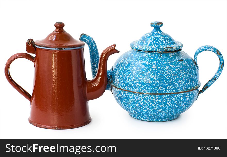 Two enameled kettle, brown and blue, isolated on white