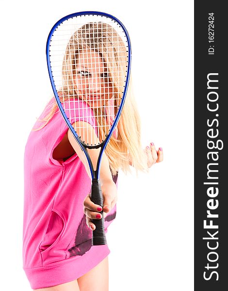 Young woman looking through a tennis racket. Young woman looking through a tennis racket