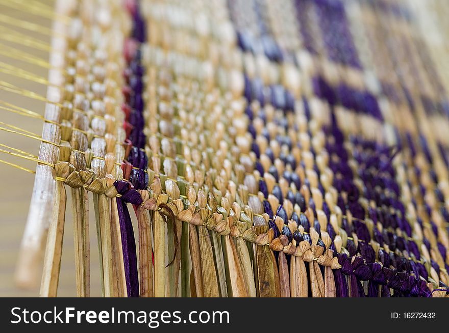 Detail of straw mat during production on a weave. Very shallow depth of field. Detail of straw mat during production on a weave. Very shallow depth of field.