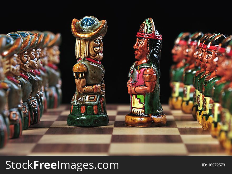 Bishop pieces of an ecuadorian chess set, between Spaniards and Incas, made of ceramic on a black background. This chess set is hand made by ecuadorian natives and it is not copyrighted. Bishop pieces of an ecuadorian chess set, between Spaniards and Incas, made of ceramic on a black background. This chess set is hand made by ecuadorian natives and it is not copyrighted.