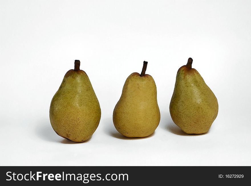 Three pears stand out against a white background