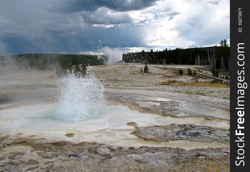 Blue hot spring bursting in yellow stone national park. Blue hot spring bursting in yellow stone national park