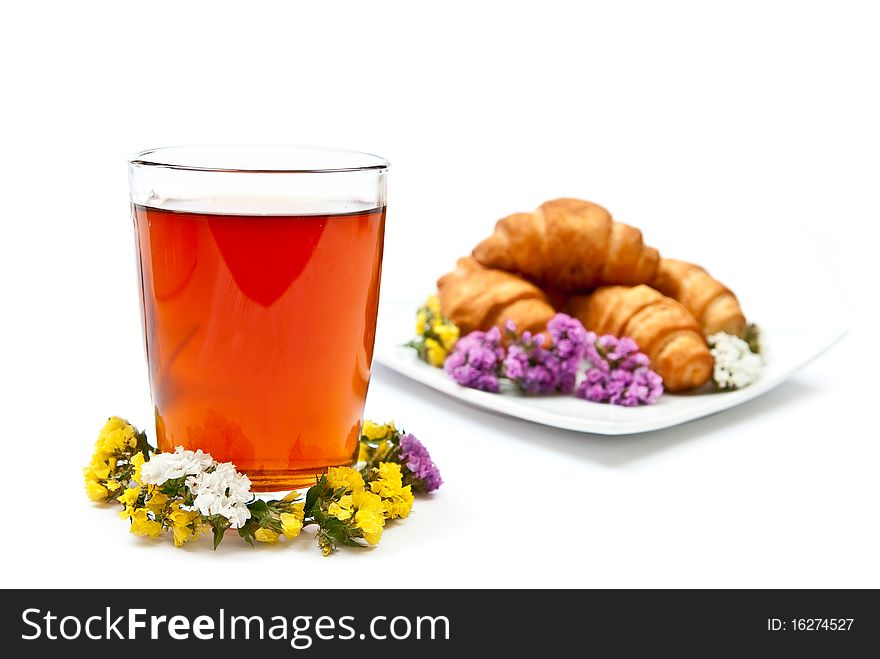 Tea and croissant with flowers design isolated on white