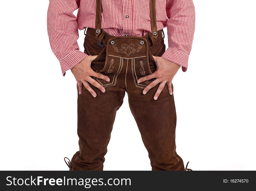 Closeup of a Bavarian man with hands in oktoberfest leather trousers (lederhose) pocket. Closeup of a Bavarian man with hands in oktoberfest leather trousers (lederhose) pocket.