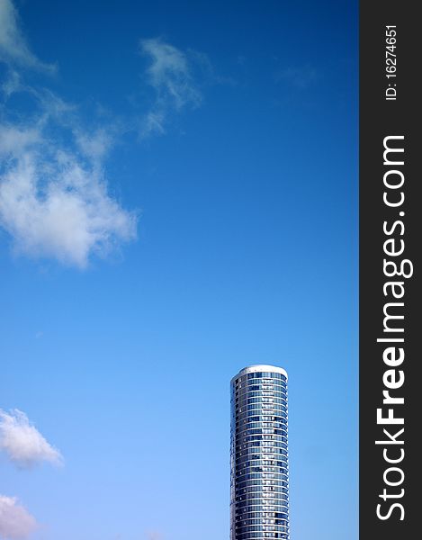 Architecture Image of Sleek Skyscraper Against Blue Sky With Copy Space. Architecture Image of Sleek Skyscraper Against Blue Sky With Copy Space