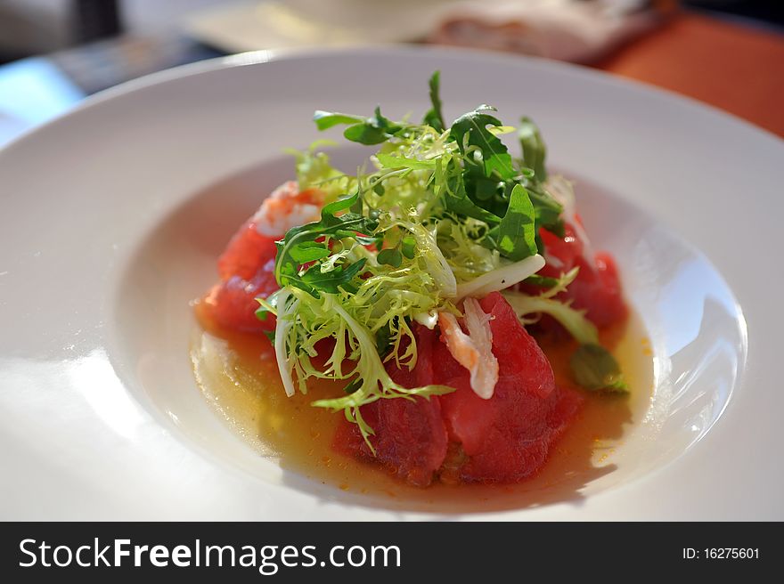 Snack with tomato, sweet pepper and fresh lettuce on white plate