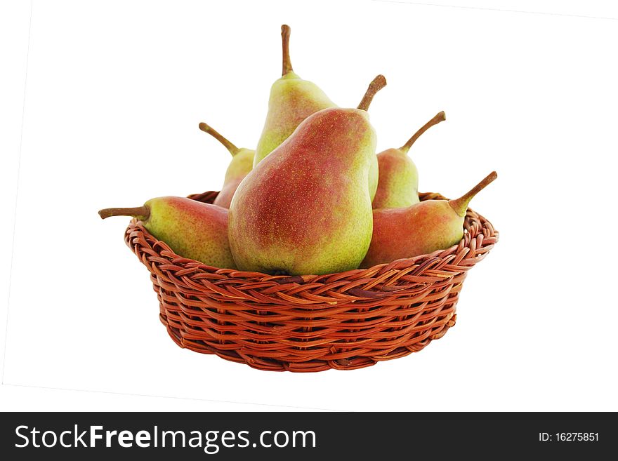 Pears in the basket isolated on white background
