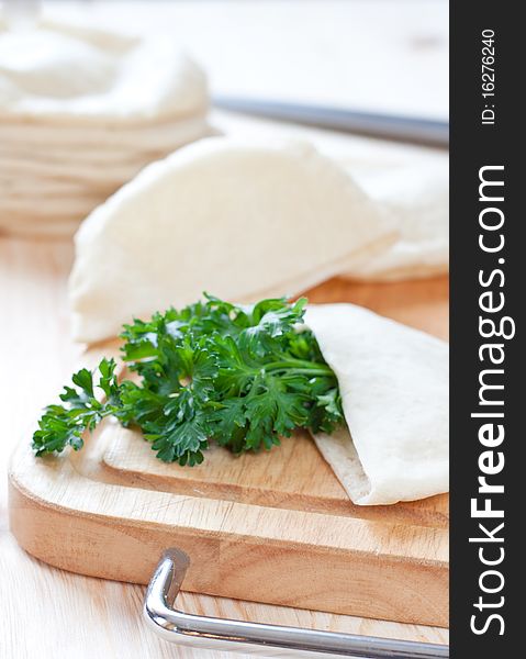 Pita bread over the cutting board. Pita bread over the cutting board